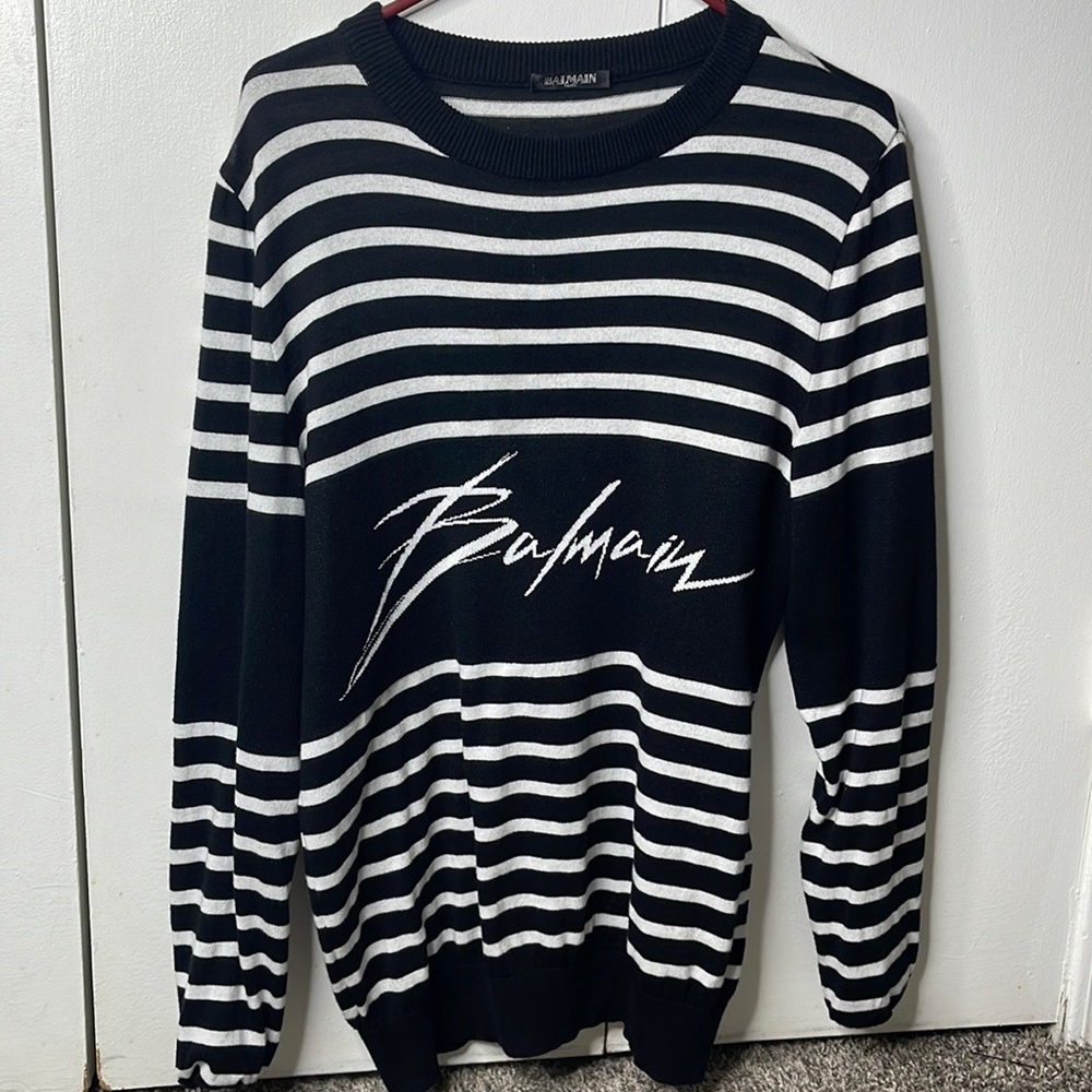 Iconic white strips sweater from Balmain. Used only once. Brand new!